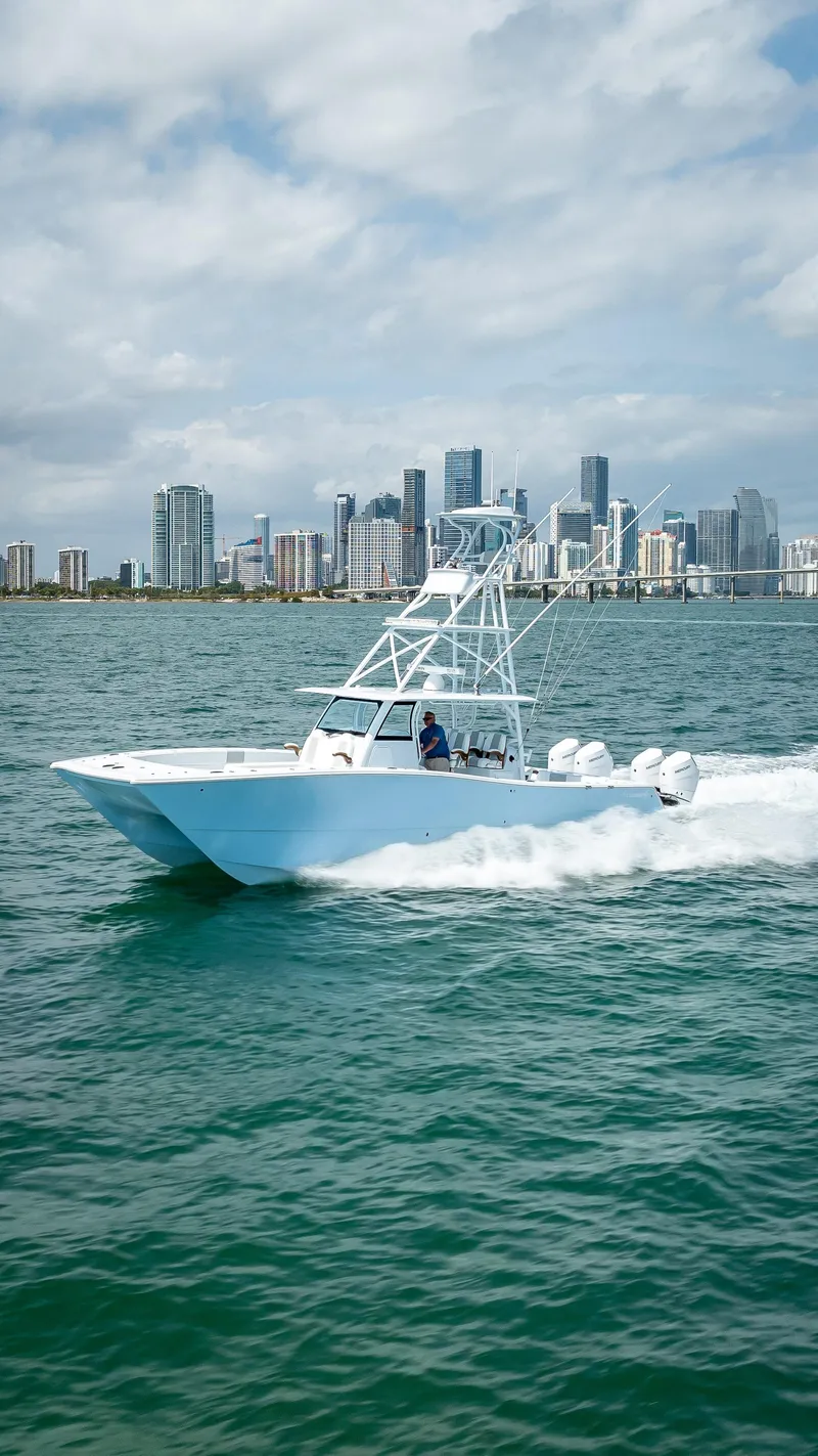 Slide: The Image of Freeman NEW 2024 boat with QUAD V10s 400 HP engines cruising near city skyline. - 48