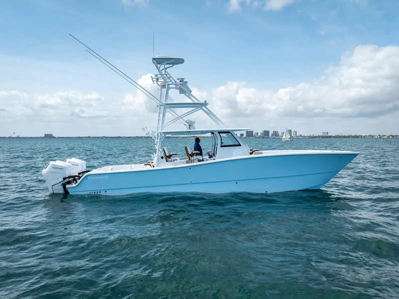 Slide: The Image of 2024 Freeman boat with quad V10 400 HP engines on open water. - 5