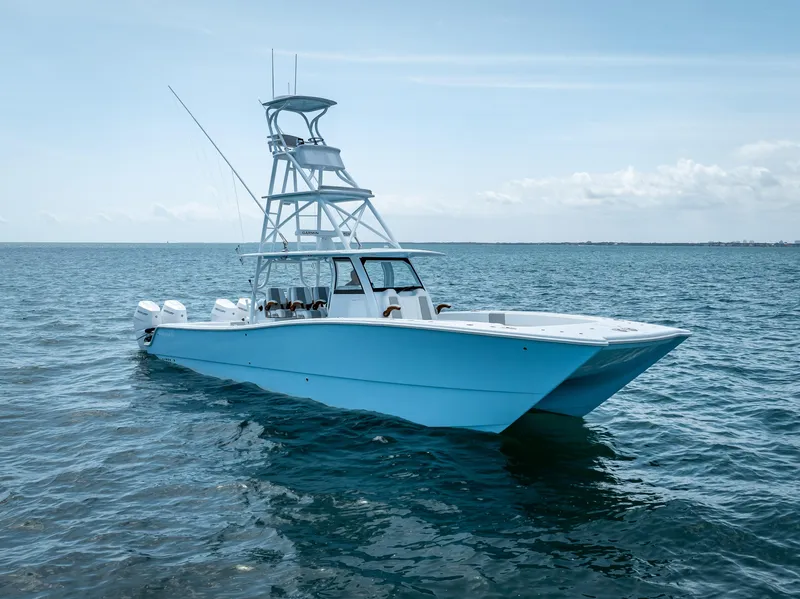 Slide: The Image of 2024 Freeman NEW QUAD V10s 400 HP boat on open water. - 8