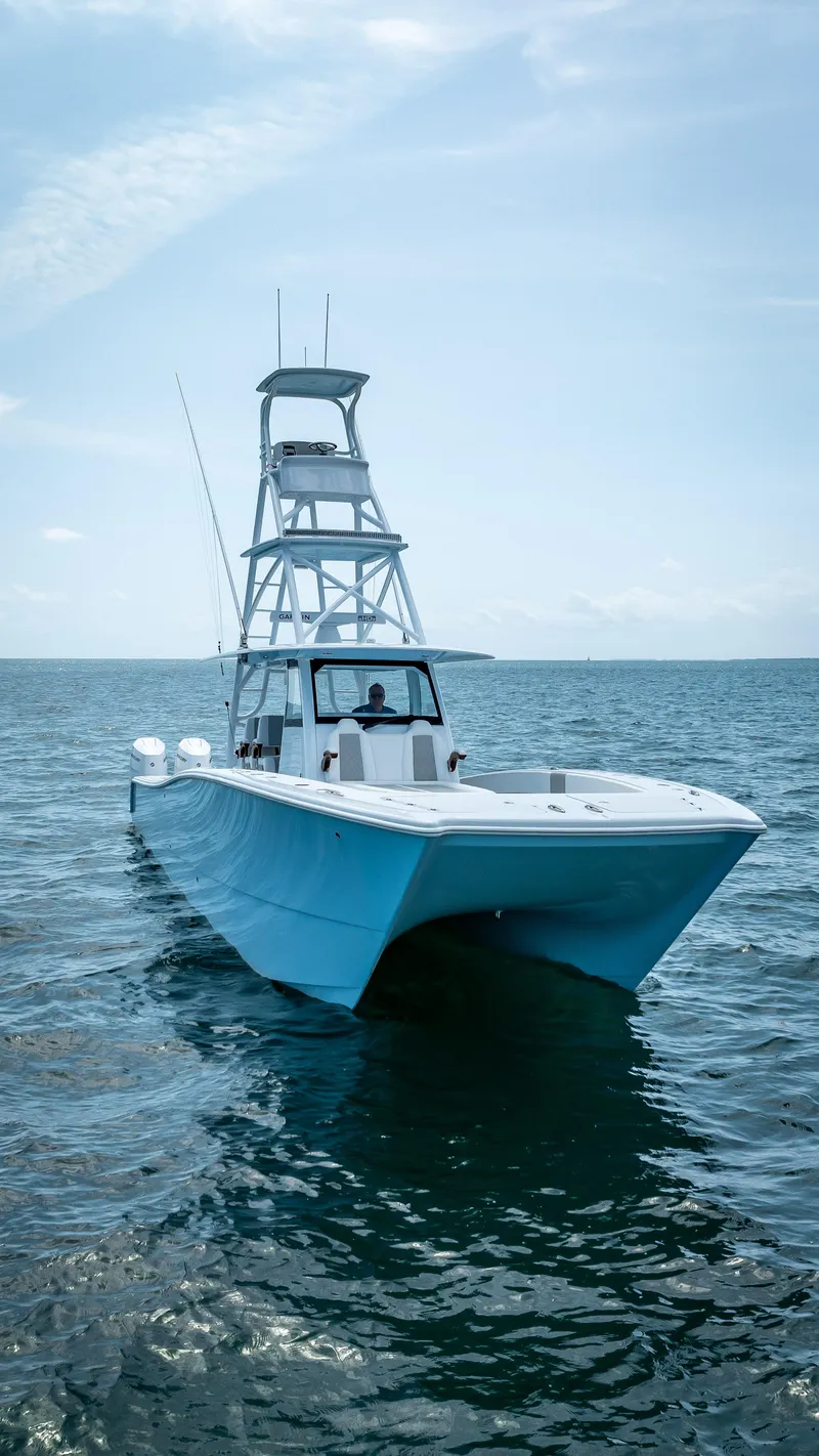 Slide: The Image of 2024 Freeman NEW QUAD V10s 400 HP boat on open water. - 9