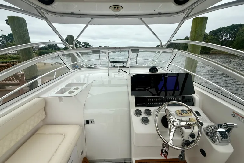 Slide: The Image of 2006 Pro-Line 32 Express boat helm with modern controls and waterfront view. - 25