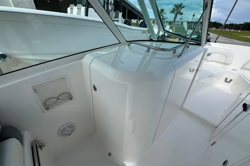 Slide: The Image of 2023 Albemarle 27 Dual Console boat interior with sleek white design and modern features. - 26