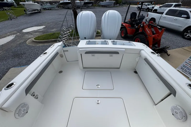 Slide: The Image of 2023 Albemarle 27 Dual Console boat interior with twin engines and spacious seating. - 33