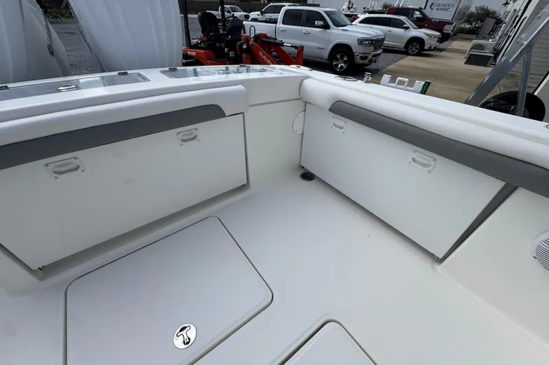 Slide: The Image of 2023 Albemarle 27 Dual Console boat interior with storage compartments and seating. - 34