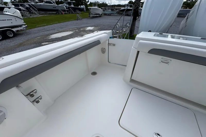 Slide: The Image of 2023 Albemarle 27 Dual Console boat interior with seating and storage compartments. - 35