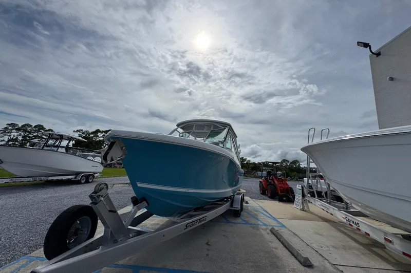 Slide: The Image of 2023 Albemarle 27 Dual Console boat on trailer under cloudy sky. - 7