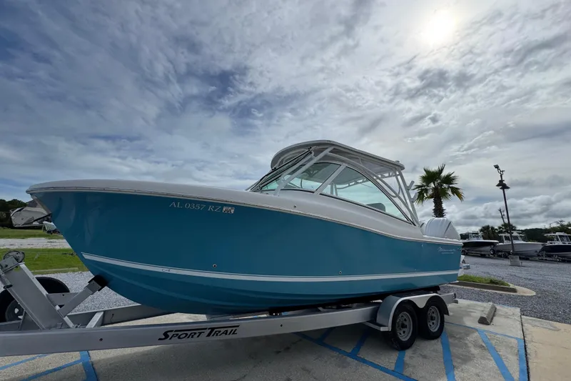 Slide: The Image of 2023 Albemarle 27 Dual Console boat on trailer under cloudy sky. - 9
