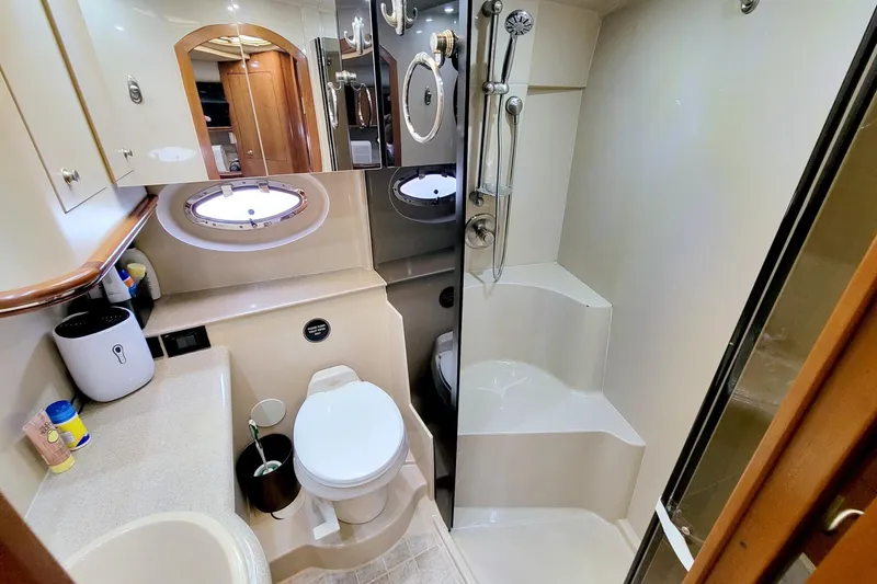 Slide: The Image of Luxurious bathroom in 2004 Cruisers Yachts 370 Express with shower and toilet. - 42