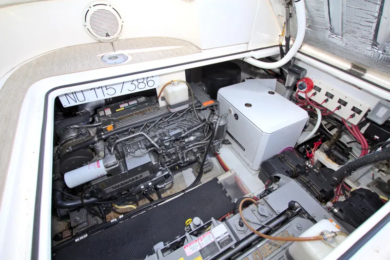 Slide: The Image of Engine compartment of 2004 Cruisers Yachts 370 Express, showcasing mechanical components and wiring. - 45