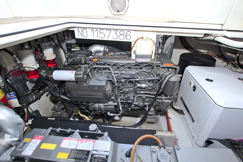 Slide: The Image of Engine room of 2004 Cruisers Yachts 370 Express, showcasing detailed mechanical components. - 46