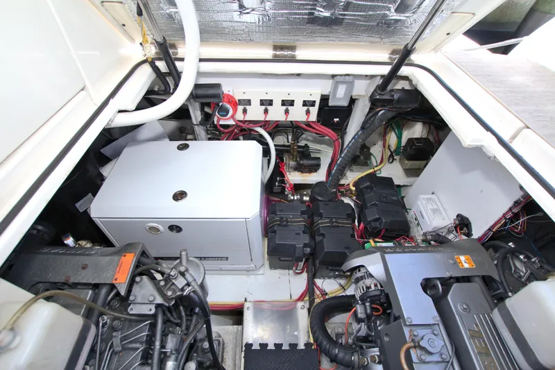 Slide: The Image of Engine compartment of 2004 Cruisers Yachts 370 Express, showcasing wiring and mechanical components. - 51