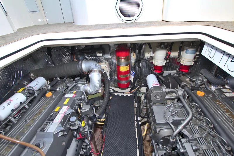 Slide: The Image of Engine room of 2004 Cruisers Yachts 370 Express, showcasing dual engines and fire suppression system. - 55