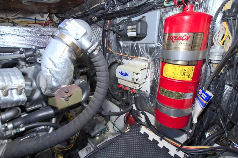 Slide: The Image of Engine room of 2004 Cruisers Yachts 370 Express with fire suppression system. - 56