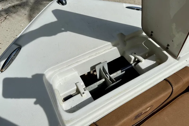 Slide: The Image of Anchor storage compartment on a 2015 Sea Hunt Ultra 234 boat, open and empty. - 13