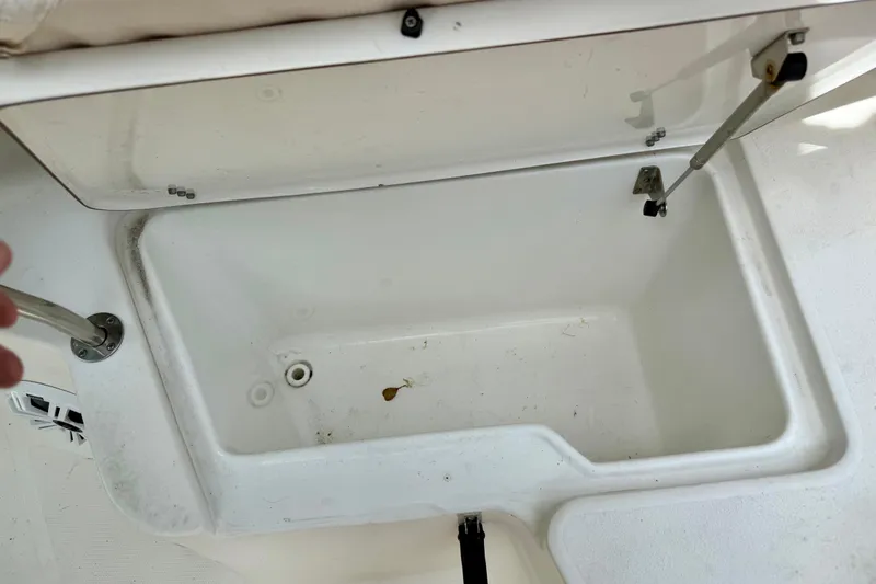 Slide: The Image of Open storage compartment on a 2015 Sea Hunt Ultra 234 boat. - 15