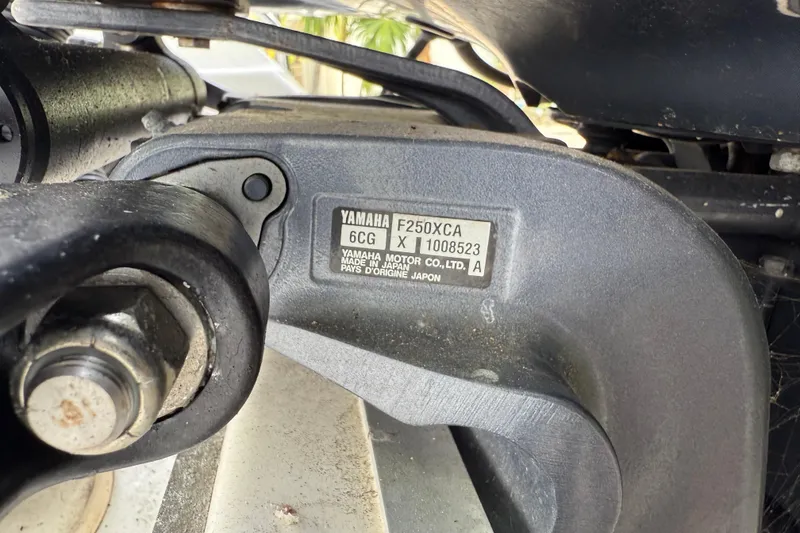 Slide: The Image of Close-up of Yamaha F250XCA engine part on 2015 Sea Hunt Ultra 234 boat. - 23