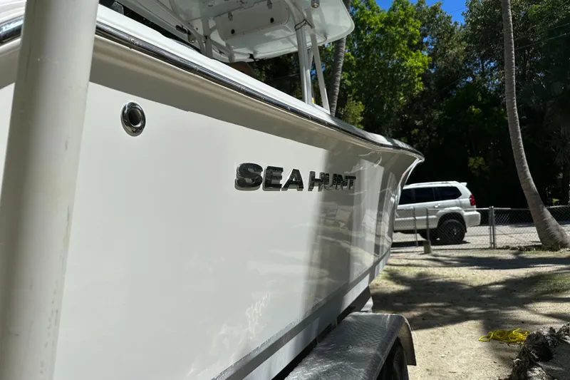 Slide: The Image of 2015 Sea Hunt Ultra 234 boat on trailer, parked outdoors. - 40
