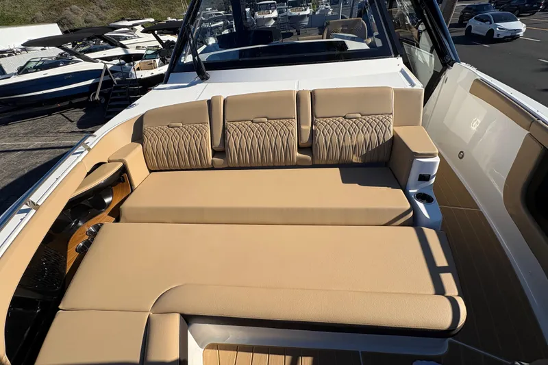 Slide: The Image of Luxurious seating on 2026 Sea Ray Sundancer 370 Outboard, featuring elegant tan upholstery. - 13