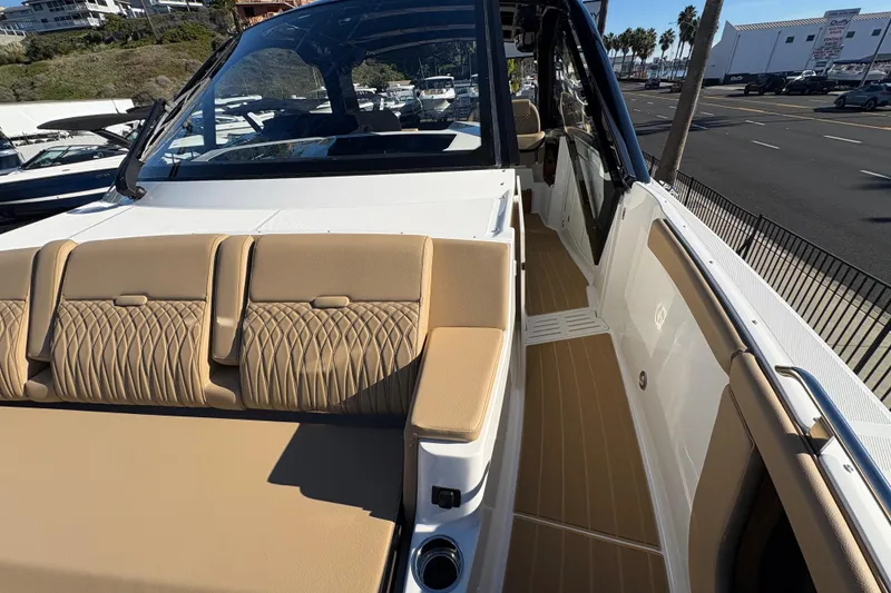 Slide: The Image of 2026 Sea Ray Sundancer 370 Outboard with luxurious tan seating and sleek design. - 14
