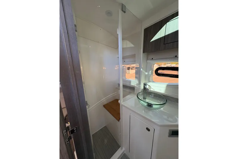 Slide: The Image of Modern bathroom interior of 2026 Sea Ray Sundancer 370 Outboard yacht with glass sink. - 22