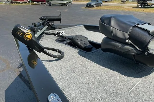 Slide: The Image of 2022 Bass Tracker PRO TEAM 175 TXW boat deck with seating and control panel. - 5