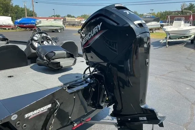 Slide: The Image of 2022 Bass Tracker PRO TEAM 175 TXW with Mercury outboard motor in a boatyard. - 6