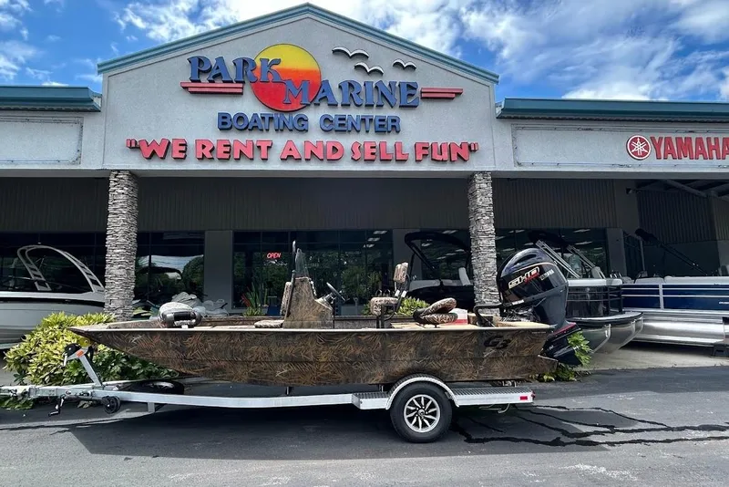 Slide: The Image of 2025 G3 Bay 19 GX Tunnel boat at Park Marine Boating Center, under a clear sky. - 0