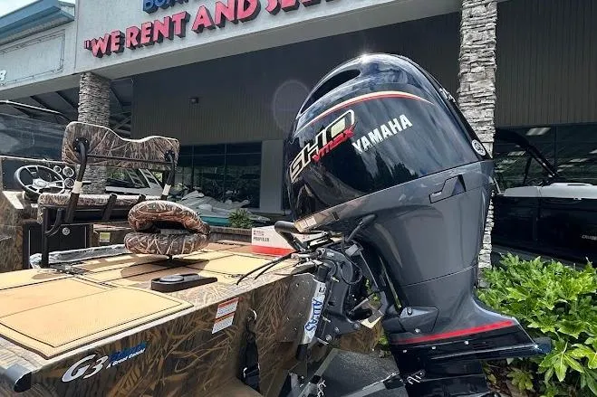 Slide: The Image of 2025 G3 Bay 19 GX Tunnel boat with Yamaha engine outside rental shop. - 3