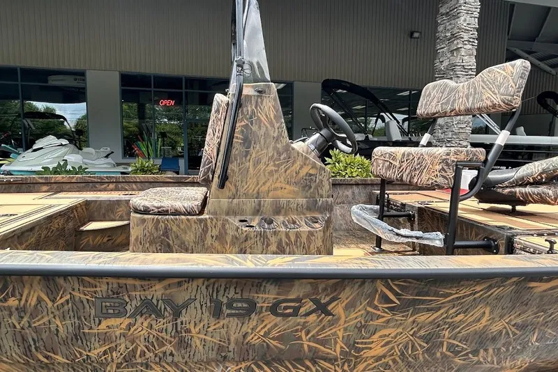 Slide: The Image of 2025 G3 Bay 19 GX Tunnel boat with camouflage design and seating. - 6