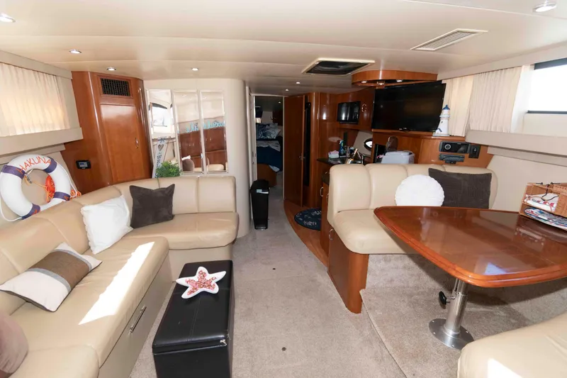 Slide: The Image of Luxurious interior of 2005 Carver 360 Mariner yacht with plush seating and elegant decor. - 13