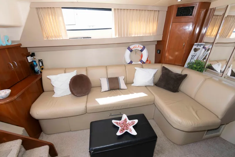 Slide: The Image of Luxurious interior of 2005 Carver 360 Mariner yacht with beige seating and decorative pillows. - 14