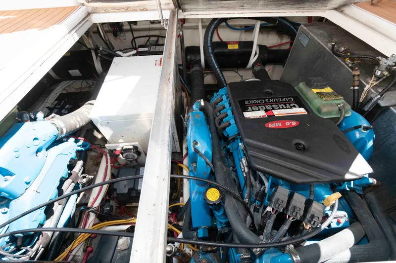 Slide: The Image of Engine compartment of a 2005 Carver 360 Mariner, featuring Crusader 6.0 MPI engines. - 21
