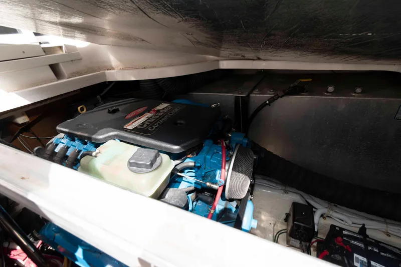 Slide: The Image of Engine compartment of a 2005 Carver 360 Mariner boat, showcasing mechanical components. - 22
