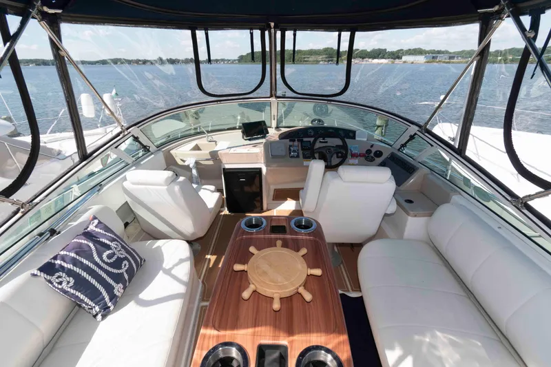 Slide: The Image of Luxurious 2005 Carver 360 Mariner yacht interior with plush seating and scenic water view. - 7