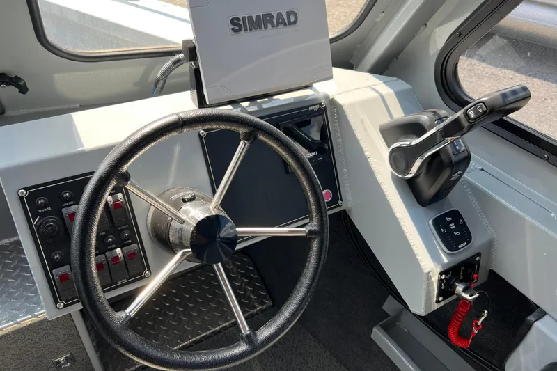 Slide: The Image of Steering wheel and controls of 2021 Hewescraft 220 Ocean Pro ET boat. - 20
