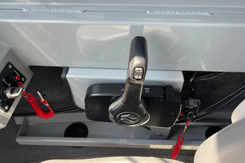 Slide: The Image of Throttle control of 2021 Hewescraft 220 Ocean Pro ET boat with safety lanyard. - 23