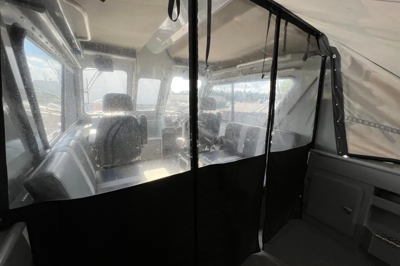 Slide: The Image of Interior view of 2021 Hewescraft 220 Ocean Pro ET boat cabin. - 29