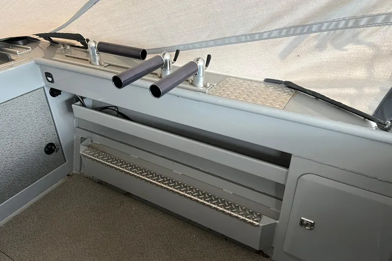 Slide: The Image of Interior view of 2021 Hewescraft 220 Ocean Pro ET boat with rod holders. - 31