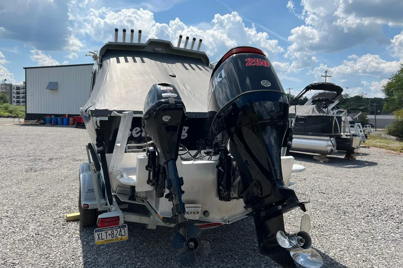 Slide: The Image of 2021 Hewescraft 220 Ocean Pro ET boat with Suzuki outboard motor in a gravel lot. - 5