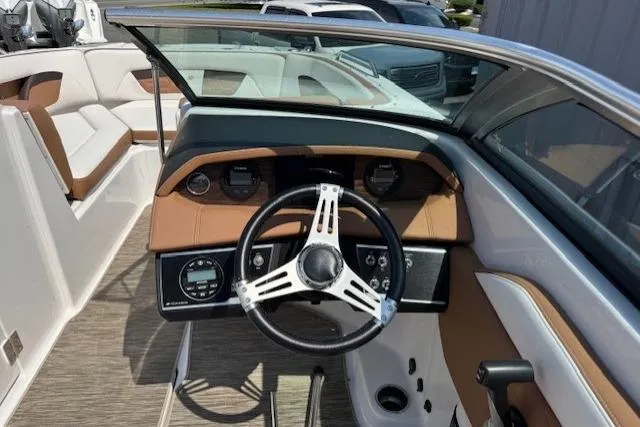 Slide: The Image of 2018 Four Winns HD220 OB boat dashboard with steering wheel and gauges. - 6