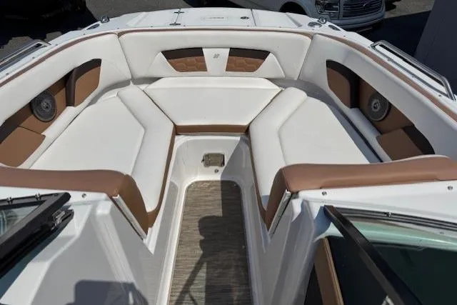 Slide: The Image of 2018 Four Winns HD220 OB boat interior with white and brown seating. - 8