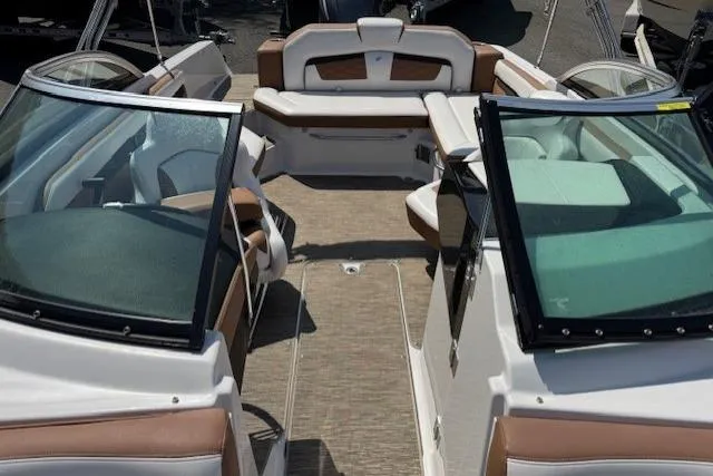 Slide: The Image of 2018 Four Winns HD220 OB boat interior with spacious seating and modern design. - 9