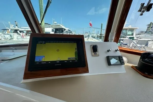 Slide: The Image of Interior view of a 1987 Holland 32 boat cockpit with controls and compass. - 17