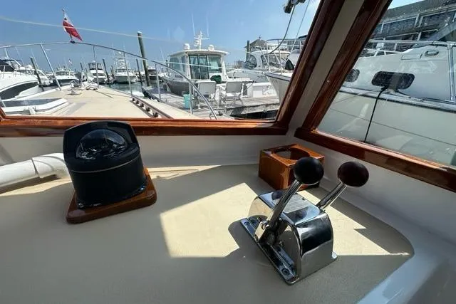 Slide: The Image of Control panel of a 1987 Holland 32 boat with gauges and switches. - 18