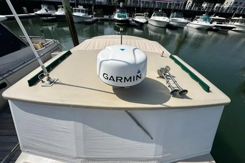 Slide: The Image of 1987 Holland 32 boat interior with wooden accents and control panel. - 21