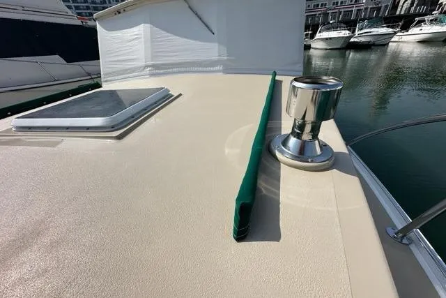 Slide: The Image of 1987 Holland 32 boat with Garmin radar, docked among other vessels. - 26