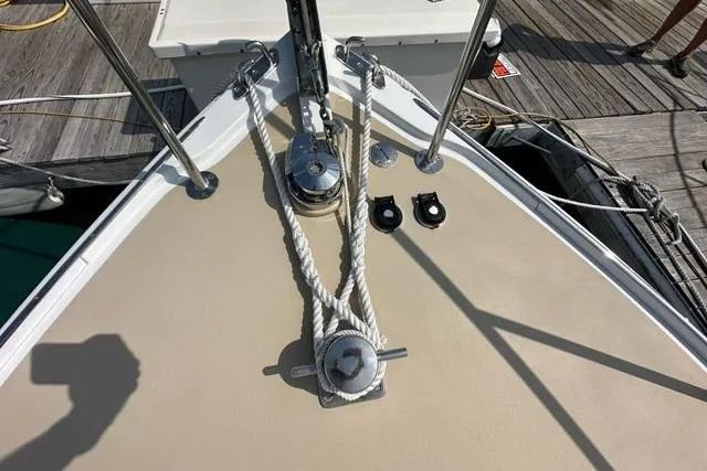 Slide: The Image of Interior of 1987 Holland 32 sailboat with kitchenette and seating area. - 32