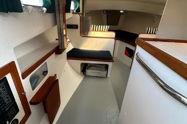 Slide: The Image of Interior of a 1987 Holland 32 boat with wood accents and a Newport heater. - 35