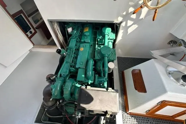 Slide: The Image of 1987 Holland 32 engine, green, detailed view in a well-lit space. - 50