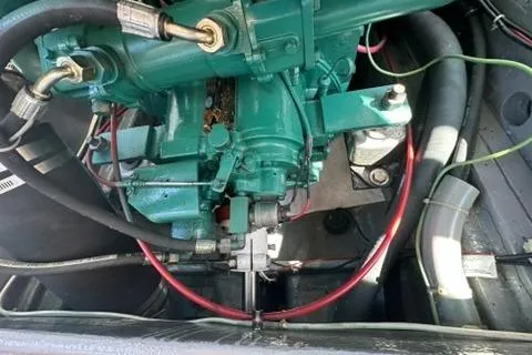 Slide: The Image of 1987 Holland 32 engine, detailed view of mechanical components and wiring. - 53